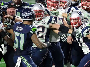 Bruce Irvin of the Seattle Seahawks and Rob Gronkowski of the New England Patriots exchange words late in the fourth quarter during Super Bowl XLIX. (Andy Lyons/Getty Images/AFP)