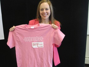 Rebecca Ulrich, Red Cross education manager for Manitoba and Nunavut, shows off a Day of Pink shirt designed to raise anti-bullying awareness in schools and the workplace.