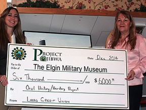 Libro representative Donna Lunn, right, presents a $6,000 cheque to Ally Shelly, coordinator of the Oral History/Herstory Project for the Elgin Military Museum and  chairman of the Youth Action Advisory Council at the museum.