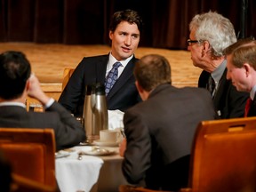 Federal Liberal leader Justin Trudeau mingles with the crowd that came to hear him speak at the Calgary Petroleum Club in downtown Calgary on Feb. 6, 2015. (Lyle Aspinall/QMI Agency)