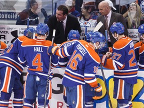 Edmonton interim head coach Todd Nelson speaks to players during a timeout against Florida during the third period of a NHL hockey game between the Edmonton Oilers and the Florida Panthers at Rexall Place in Edmonton, Alta., on Sunday, Jan. 11, 2015. Ian Kucerak/Edmonton Sun/ QMI Agency