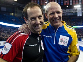 Ontario second Brent Laing, left, and Alberta skip Kevin Martin, right, after Alberta defeated Ontario during the 2013 Tim Hortons Brier at Rexall Place in Edmonton, Alta., on Friday, March 8, 2013. Codie McLachlan/Edmonton Sun/QMI Agency
