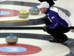 Mark Kean, right, eyes an incoming shot in their game against Team Epping Friday Feb. 6, 2015 afternoon at the Flight Exec Centre in Dorchester, Ont. during the Ontario Men's Curling Championship. Team Kean won both their Friday games to finish with an 8-2 record to lead the Tankard heading into the weekend playoffs. (GREG COLGAN, Sentinel-Review)