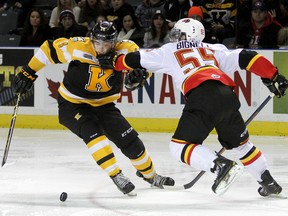 Kingston Frontenacs’ Jake Gilmour gets held up by  the Belleville Bulls’ Adam Bignell during Ontario Hockey League action at the Rogers K-Rock Centre on Friday night. The Bulls won 4-3. (Ian MacAlpine/The Whig-Standard)