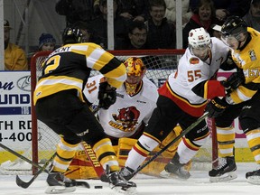 Kingston Frontenacs defenceman Evan McEneny gets ready to score on Belleville Bulls goalie Charlie Graham as defenceman Adam Bignell holds off Lawson Crouse during Ontario Hockey League action at the Rogers K-Rock Centre on Friday night. The Bulls won 4-3. (Ian MacAlpine/The Whig-Standard)
