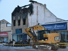 Exeter's main street remained closed in the downtown section Saturday morning after a blaze gutted a three-storey building that housed a business and apartments. John Miner/The London Free Press