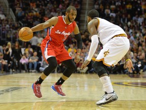Clippers guard Chris Paul (left) drives against Cavaliers guard Kyrie Irving (right) in the second quarter of NBA play in Cleveland on Thursday, Feb. 5, 2015. (David Richard/USA TODAY Sports)