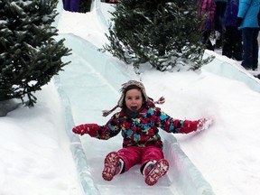 Lily O'Hara 4, who attends Our Lady of Mount Carmel Catholic School, enjoys the ice slides  at Confederation Park in Kingston, Ont. on Saturday February 7, 2015 during Feb Fest. Steph Crosier/Kingston Whig-Standard/QMI Agency