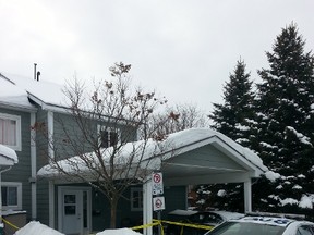 Police tape surrounds a unit at 181 Forestglade Cr., where police confirm Yusuf Ibrahim, 27, was shot and killed in a targeted gang-related homicide on Friday, Feb. 6, 2015. Investigators and police were still on the scene Saturday, Feb. 7, 2015 and have yet to identify suspects. 
Keaton Robbins/Ottawa Sun/QMI Agency