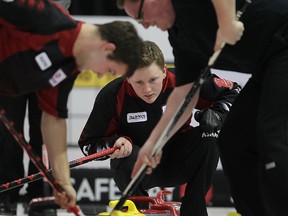 Skip Braden Calvert directs sweepers during Safeway Select curling in Brandon. (BRIAN DONOGH/Winnipeg Sun)