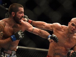 Robbie Lawler (red gloves) punches Matt Brown (blue gloves) during the welterweight bout of the FOX UFC Saturday at SAP Center.  Kyle Terada-USA TODAY Sports