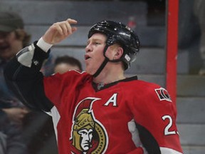 Chris Neil from the Ottawa Senators tries to get the crowd pumped up after he fought Columbus Blue Jackets Dalton Prout during second period action at the Canadian Tire Centre in Ottawa Saturday Feb 7, 2015.   Tony Caldwell/Ottawa Sun/QMI Agency
