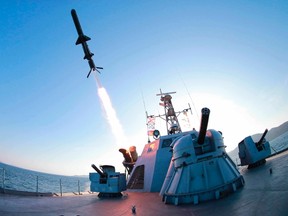 A missile is fired from a naval vessel during the test-firing of a new type of anti-ship cruise missile to be equipped at Korean People's Army (KPA) naval units in this undated photo released by North Korea's Korean Central News Agency (KCNA) in Pyongyang February 7, 2015. REUTERS/KCNA