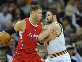 Los Angeles Clippers forward Blake Griffin (32) dribbles against Cleveland Cavaliers forward Kevin Love (0) in the third quarter at Quicken Loans Arena. (David Richard-USA TODAY Sports)