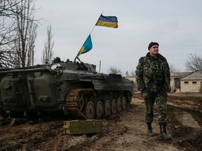 A Ukrainian serviceman is pictured at his position near Debaltseve, eastern Ukraine, February 8, 2015. REUTERS/Gleb Garanich