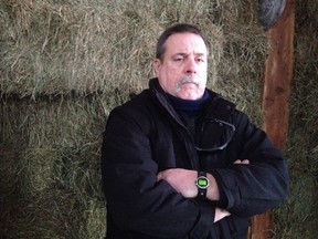 Gerald Mcewen stands in the north Kanata barn where he encountered a cougar Feb. 4. (Keaton Robbins/Ottawa Sun)