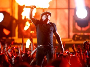 Brian Johnson of AC/DC performs a medley of songs to open the show at the 57th annual Grammy Awards in Los Angeles, California February 8, 2015.  REUTERS/Lucy Nicholson
