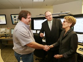 John Lappa/The Sudbury Star 
In this file photo, Mark Bardswich, left, Totten Mine operations control centre supervisor, greets Ontario Premier Kathleen Wynne as Bob Booth, mine manager of Totten Mine, looks on at the official opening of Vale's Totten Mine in Worthington on Feb. 1, 21, 2014.