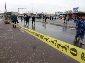 Police tape is hung near the site where a suicide bomber detonated explosives.

AFP PHOTO/SABAH ARAR