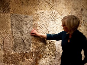 Fibre artist Linda Dineen describes a piece of art, Extreme Chenille, by Mary Ann Rich at the Ingersoll Creative Arts Centre, where the fibre arts exhibition Connections opened on Sunday. (BRUCE CHESSELL/Sentinel-Review​)