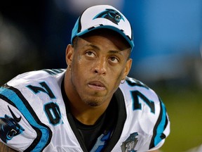 Greg Hardy #76 of the Carolina Panthers watches from the bench during the fourth quarter of a loss to the Buffalo Bills at Bank of America Stadium on August 8, 2014 in Charlotte, North Carolina. (Grant Halverson/Getty Images/AFP)