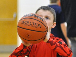 Kale Murray shows off his winning form, plus a little body English, to win the nine-year-old boys division at the Mitchell-Logan Knights of Columbus Youth Free Throw championship at Upper Thames Elementary School (UTES) last Monday, Feb. 2. ANDY BADER/MITCHELL ADVOCATE