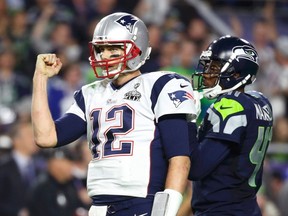 New England Patriots quarterback Tom Brady celebrates his fourth quarter touchdown pass against the Seattle Seahawks during last week's Super Bowl. On Monday, Winnipeg police announced a charge had been laid against a 46-year-old man in connection with an illegal fantasy football pool. (REUTERS/Lucy Nicholson)