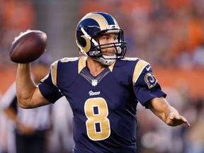 Sam Bradford #8 of the St. Louis Rams drops back to pass during the first quarter against the Cleveland Browns at FirstEnergy Stadium on August 23, 2014 in Cleveland, Ohio.  Joe Robbins/Getty Images/AFP