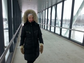 Helen Finn tries out the new pedestrian bridge over Hwy. 417 after the official opening Monday, Feb. 9, 2015.
JON WILLING/OTTAWA SUN/QMI AGENCY