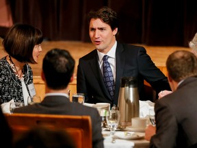Federal Liberal leader Justin Trudeau mingles with the crowd that came to hear him speak at the Calgary Petroleum Club in downtown Calgary, Alta., on Friday, Feb. 6, 2015. 
Lyle Aspinall/Calgary Sun/QMI Agency