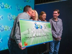 Gregory and Tammy Nikolopoulos - $50-million Lotto Max winners - with kids Jennifer and Kaden at the OLG Prize Centre in Toronto on Monday February 9, 2015. (Ernest Doroszuk/Toronto Sun)