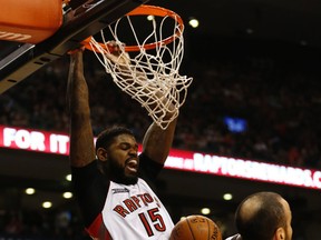 Amir Johnson slam dunks during the Raptors’ 87-82 win over San Antonio on Sunday. Johnson was one of the Raptors who stepped up to shut down the Spurs’ attack. (Jack Boland/Toronto Sun)