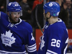 Toronto Maple Leafs forwards Nazem Kadri (left) and Daniel Winnik  celebrate a shootout win over the Los Angeles Kings at the Air Canada Centre on Dec. 14, 2014. (JOHN E. SOKOLOWSKI/USA TODAY Sports)
