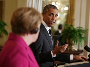 U.S. President Barack Obama speaks during a joint news conference with German Chancellor Angela Merkel in the East Room of the White House in Washington on Feb. 9, 2015. (REUTERS/Gary Cameron)