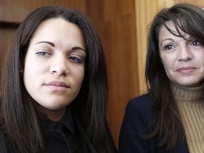 Manon Serrano (L) and her mother Sophie Serrano (R) answer journalists' questions,  on December 1, 2014 at Grasse courthouse, after a hearing regarding the 12 millions euro compensation the Serrano family along with another family requested against a private hospital for switching their baby daughters 20 years ago.   AFP PHOTO / VALERY HACHE