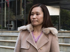 Law Wan-tung, former employer of Indonesian domestic helper Erwiana Sulistyaningsih, leaves the district court in Hong Kong, in this Jan. 8, 2015 file photo. (REUTERS/Tyrone Siu/Files)