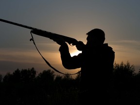 hunter holding rifle