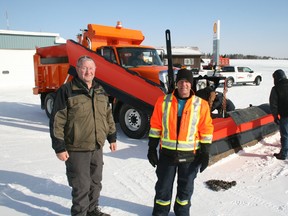 Kenora Airport Authority chairman Don McDougald and airport manager Mike Zroback were on hand to take delivery of a brand new piece of airport equipment on Wednesday, Feb. 4. The $213,000 acquisition was primarily purchased with a federal Capital Airport Assistance Program grant and the airport authority covering the balance. The specially-equipped International truck will improve runway snow clearing operations as it is capable of plowing and sanding in a single pass.