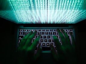 A man types on a computer keyboard in Warsaw in this February 28, 2013 illustration file picture. Newsweek magazine's Twitter account was the victim of hackers on Tuesday. (REUTERS/Kacper Pempel/Files)