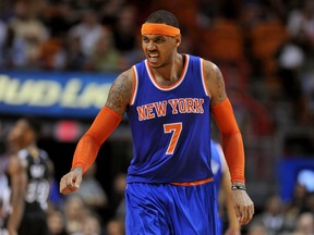 New York Knicks forward Carmelo Anthony (7) reacts after injuring himself during the second half  against the Miami Heat at American Airlines Arena. (Steve Mitchell-USA TODAY Sports)