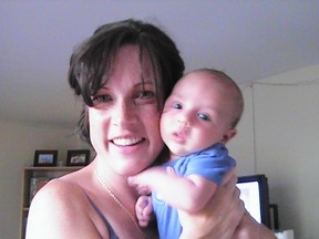 Mary Rodrigues holds her baby Alex, shortly before the crash that took the infant's life. (Family photo)