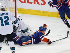 Edmonton Oilers forward Taylor Hall (4) scores on San Jose goaltender Antti Niemi (31) during the third period of an NHL game between the San Jose Sharks and the Edmonton Oilers at Rexall Place in Edmonton, Alta., on Tuesday, Feb. 2, 2015. (Ian Kucerak photo)