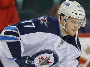 Winnipeg Jets Adam Lowry during NHL hockey in Calgary, Alta. on Monday February 2, 2015. Al Charest/Calgary Sun/QMI Agency