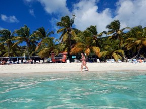 White Bay Beach is lined with quirky beach bars, white sand and turquoise Caribbean water. STEVE MACNAULL PHOTO