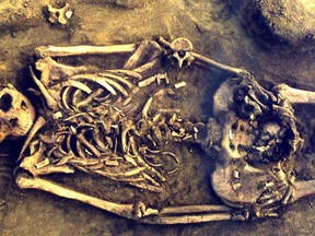 Saskatchewan bio-archeologist Angela Lieverse led the discovery of a nearly 8,000-year-old skeleton of a mother and her twins that are the earliest confirmed set of human multiples. (QMI Agency/Vladimir Bazaliiskii)