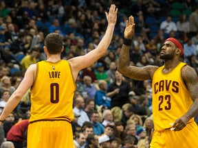 Cleveland Cavaliers forward Kevin Love celebrates with forward LeBron James during the fourth quarter against the Minnesota Timberwolves at Target Center. (Brace Hemmelgarn/USA TODAY Sports)