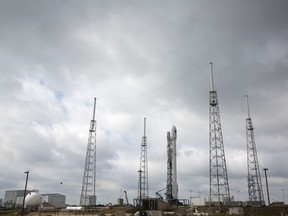 The unmanned SpaceX Falcon 9 rocket, carrying NOAA's Deep Space Climate Observatory Satellite, sits on launch pad 40 at the Cape Canaveral Air Force Station in Cape Canaveral, Florida February 10, 2015. Space Exploration Technologies will try again Tuesday to launch the rocket with the U.S. satellite intended to watch for threatening solar storms, NASA said on Monday. REUTERS/Scott Audette