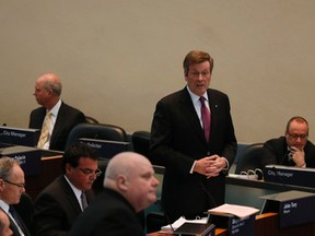 Toronto Mayor John Tory and Councillor Rob Ford in council chambers Tuesday, February 10, 2015. (Stan Behal/Toronto Sun)