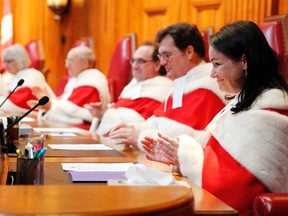 Newly appointed Justice Suzanne Cote (R) takes part in a ceremony at the Supreme Court of Canada in Ottawa February 10, 2015.    REUTERS/Blair Gable