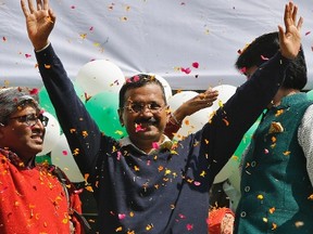 Arvind Kejriwal, Aam Aadmi (Common Man) Party (AAP) chief and its chief ministerial candidate for Delhi, waves to his supporters in New Delhi February 10, 2015. (REUTERS/Adnan Abidi)